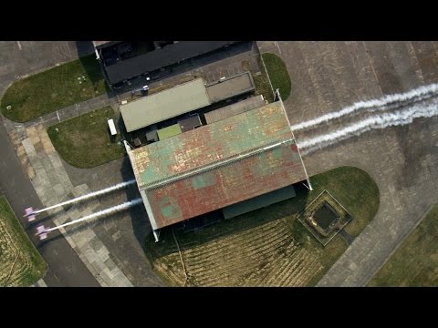 Two Planes Fly Through a Hangar â Red Bull Barnstorming