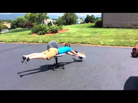 My brother having fun with a leaf blower and an office chair