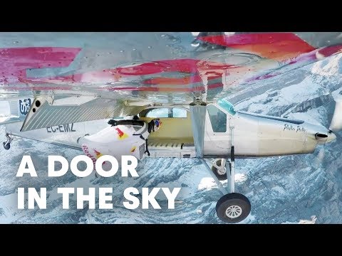 2 wingsuit flyers BASE jump into a plane in mid-air. | A Door In The Sky